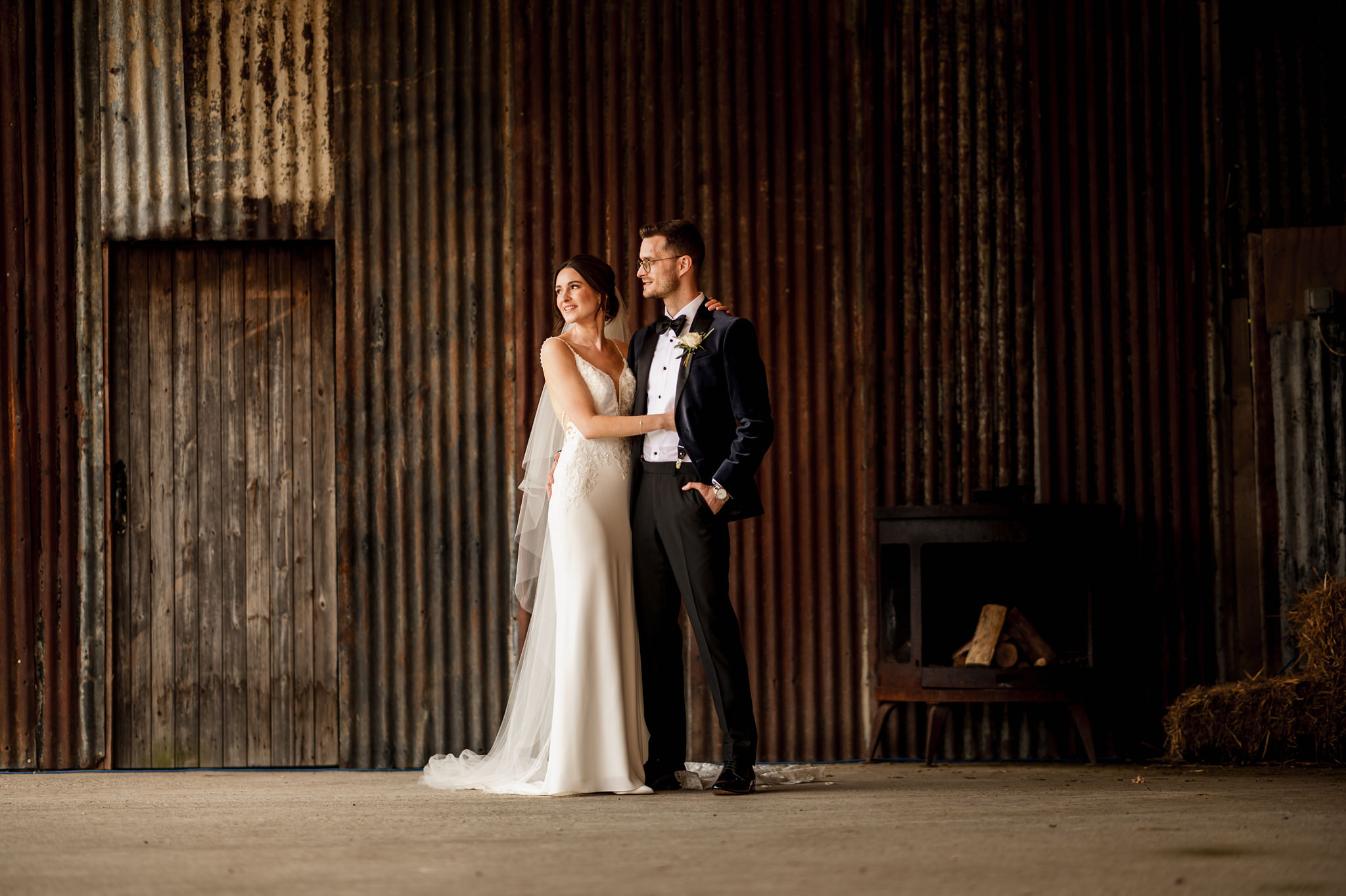 Bride and Groom in the dutch barn at Silchester Farm Wedding.